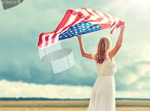 Image of happy woman with american flag on cereal field