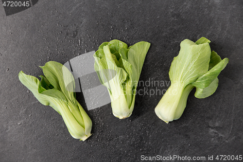 Image of close up of bok choy cabbage on slate background