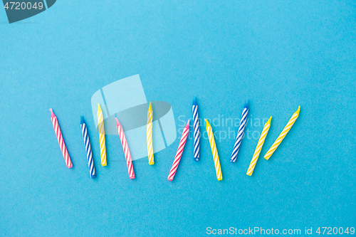 Image of birthday candles on blue background