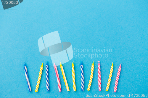 Image of birthday candles on blue background