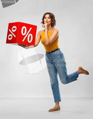 Image of happy smiling young woman with sale sign