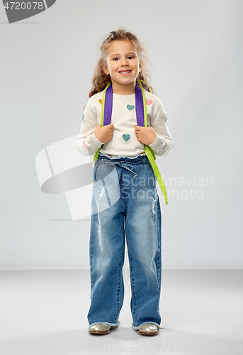 Image of happy little girl with school backpack