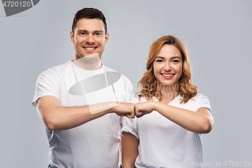 Image of portrait of happy couple in white t-shirts