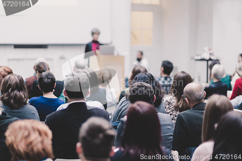 Image of Woman giving presentation on business conference.