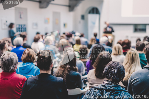 Image of Man giving presentation in lecture hall at university.