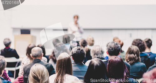 Image of Woman giving presentation on business conference.