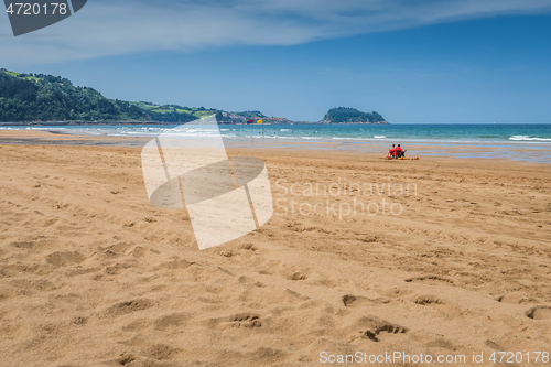 Image of Lifeguards sitting and watching on the ocean on a beautiful summer day