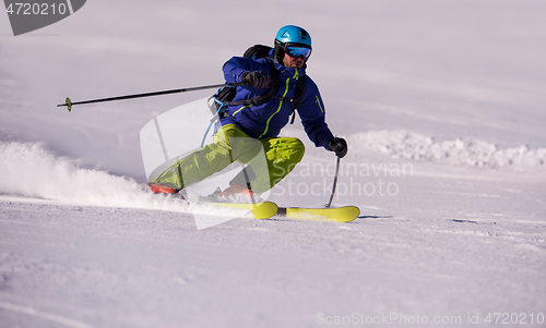 Image of Skier having fun while running downhill