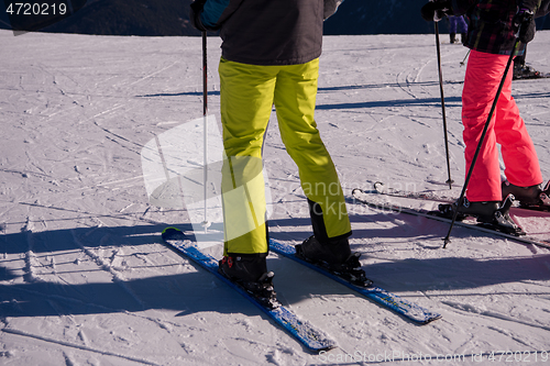 Image of group of happy people having fun on snow