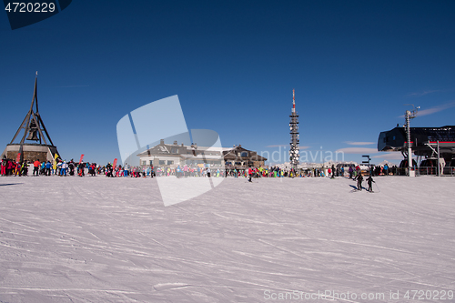 Image of group of happy people having fun on snow