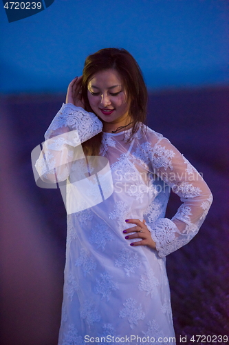 Image of portrait of and asian woman in lavender flower field