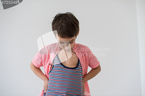 Image of lilittle boy looking at heart love symbol sketched on his chest