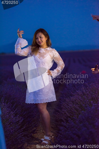 Image of portrait of and asian woman in lavender flower field