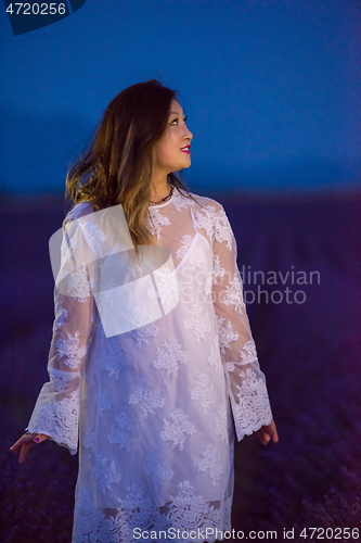 Image of portrait of and asian woman in lavender flower field