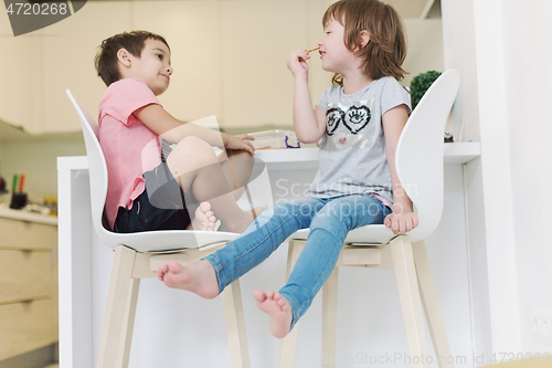 Image of cute little brother and sister at home