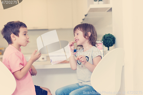 Image of cute little brother and sister at home