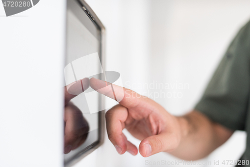 Image of smart home and technology concept close up of male hands