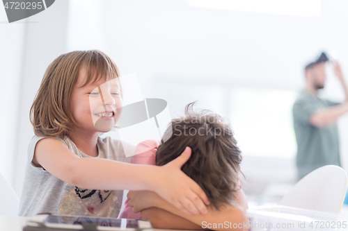 Image of cute little brother and sister having fun at home