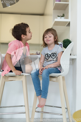 Image of cute little brother and sister at home