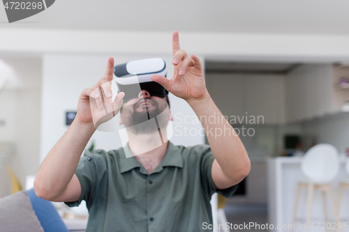 Image of man with beard trying vr glasses