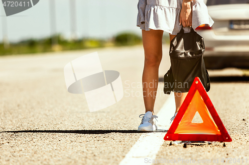 Image of Young couple traveling on the car in sunny day