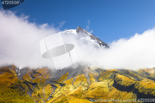 Image of volcano Taranaki covered in clouds, New Zealand 