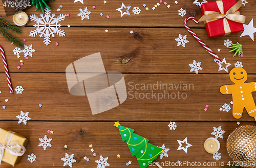 Image of christmas gifts and decorations on wooden boards