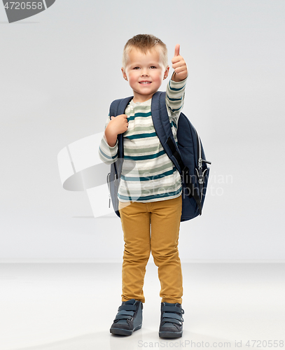 Image of portrait of smiling boy with school backpack