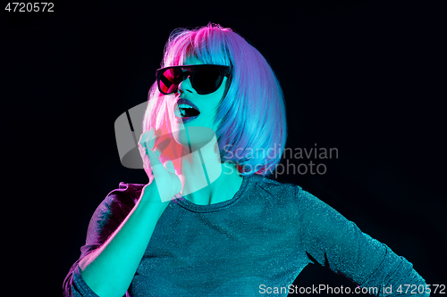 Image of happy woman in pink wig and black sunglasses