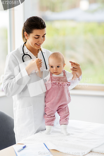 Image of female pediatrician doctor with baby at clinic