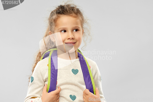 Image of happy little girl with school backpack