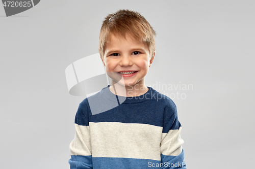 Image of portrait of little boy in striped pullover