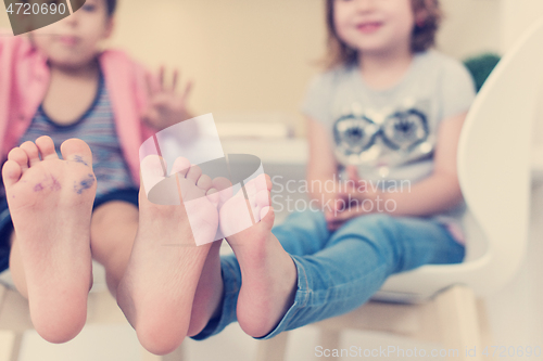 Image of cute little brother and sister at home