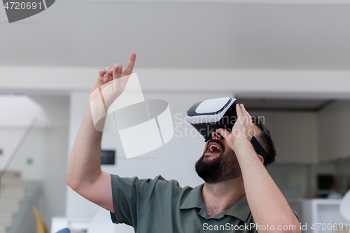 Image of man with beard trying vr glasses