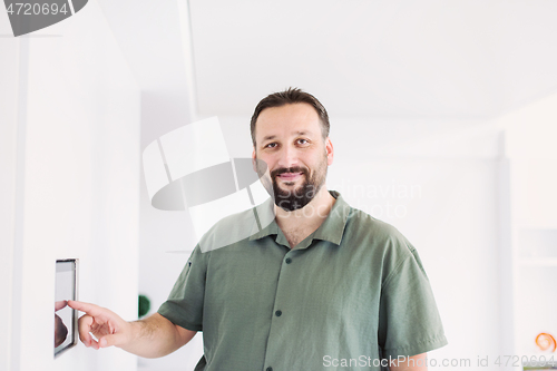 Image of smart home and technology concept close up of male hands