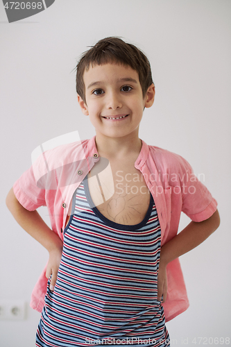Image of lilittle boy looking at heart love symbol sketched on his chest