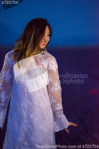 Image of portrait of and asian woman in lavender flower field