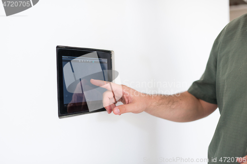 Image of smart home and technology concept close up of male hands