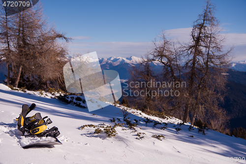 Image of snowboard in snow