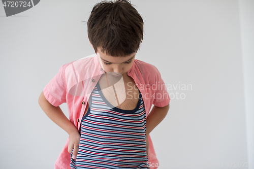 Image of lilittle boy looking at heart love symbol sketched on his chest