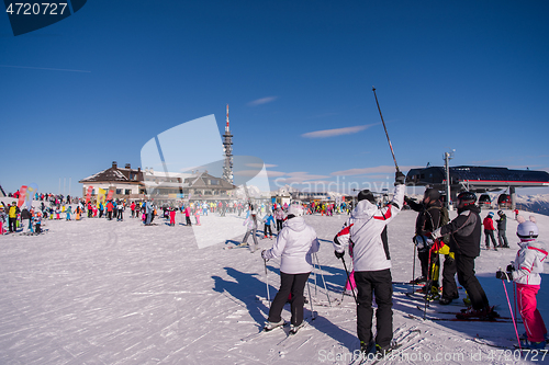 Image of group of happy people having fun on snow