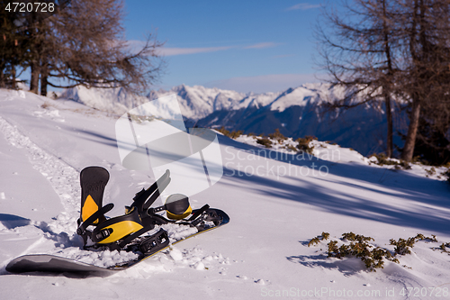 Image of snowboard in snow