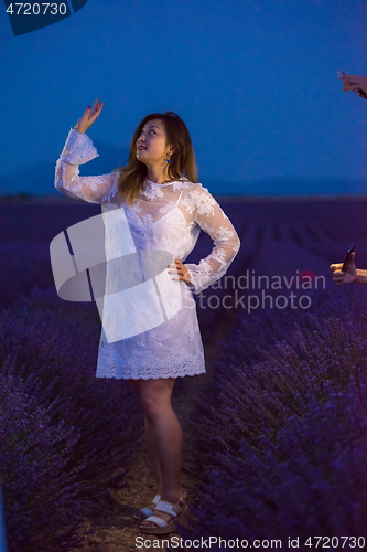 Image of portrait of and asian woman in lavender flower field