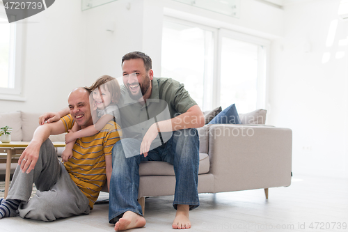 Image of Portrait of male gay couple with adopted childre