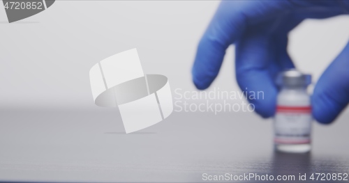 Image of Vaccine in human hands closeup footage