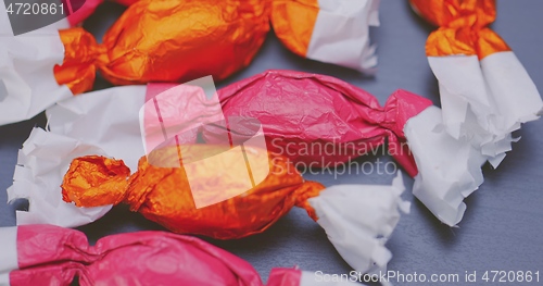 Image of Christmas candy lying on the table with camera in motion closeup