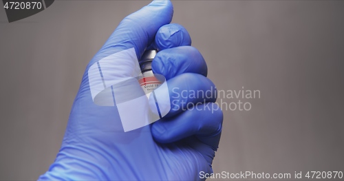 Image of Vaccine in human hands closeup footage