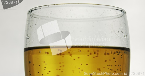 Image of Glass of beer on the table slow motion footage