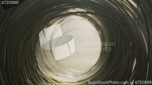 Image of Camera motion in round steel wired tunnel