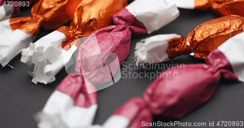 Image of Christmas candy lying on the table with camera in motion closeup
